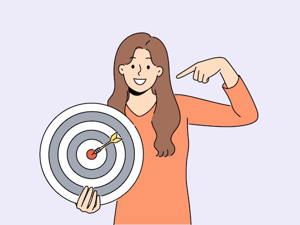 Woman hitting bullseye on dartboard representing achieving earning goals and financial targets